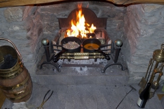Cooking on the Open Fire by Candlelight
